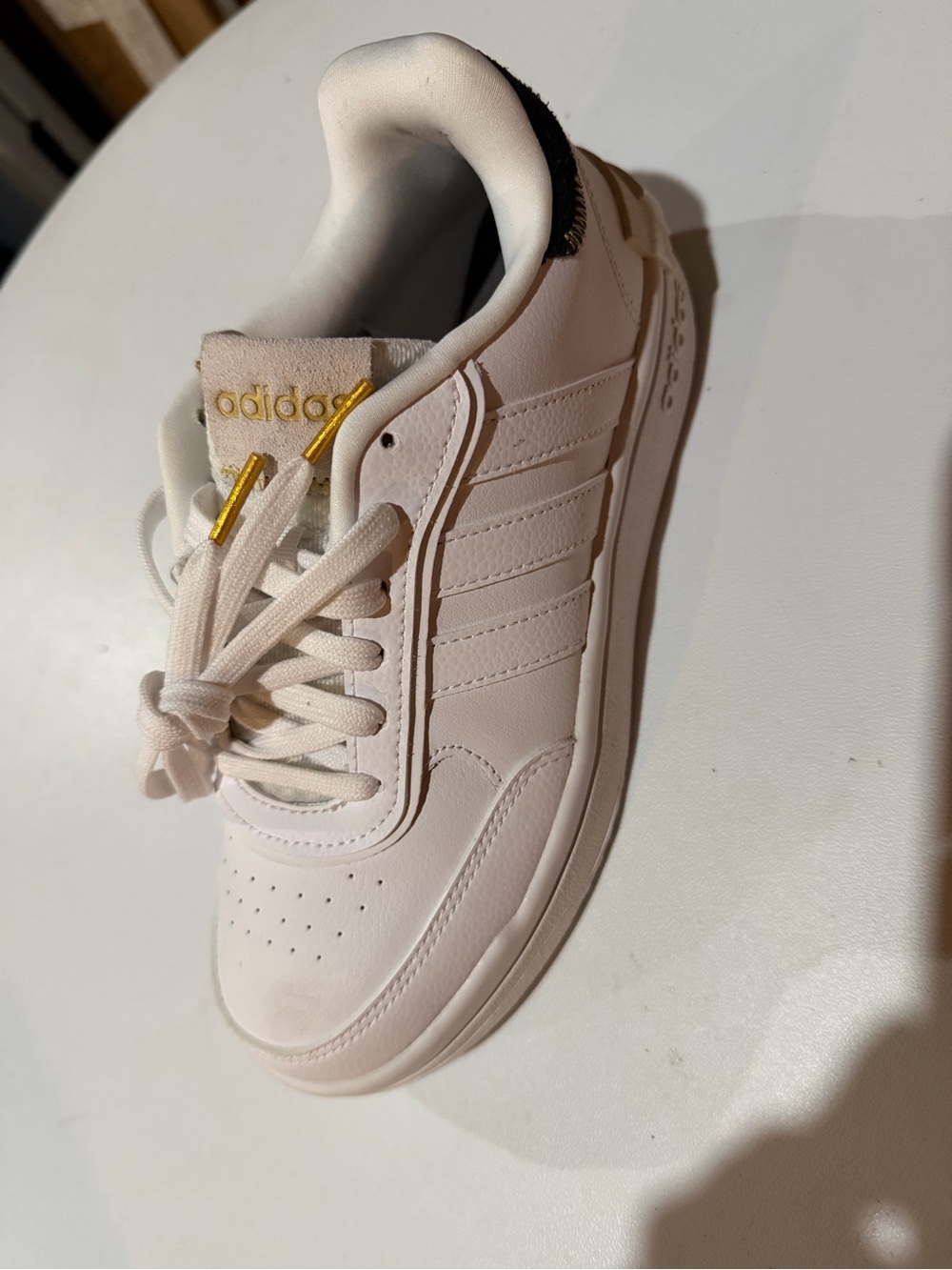 adidas White Leather Low-Top Sneaker with Gold Accents